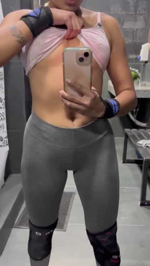 Petite being naughty in the gym bathroom