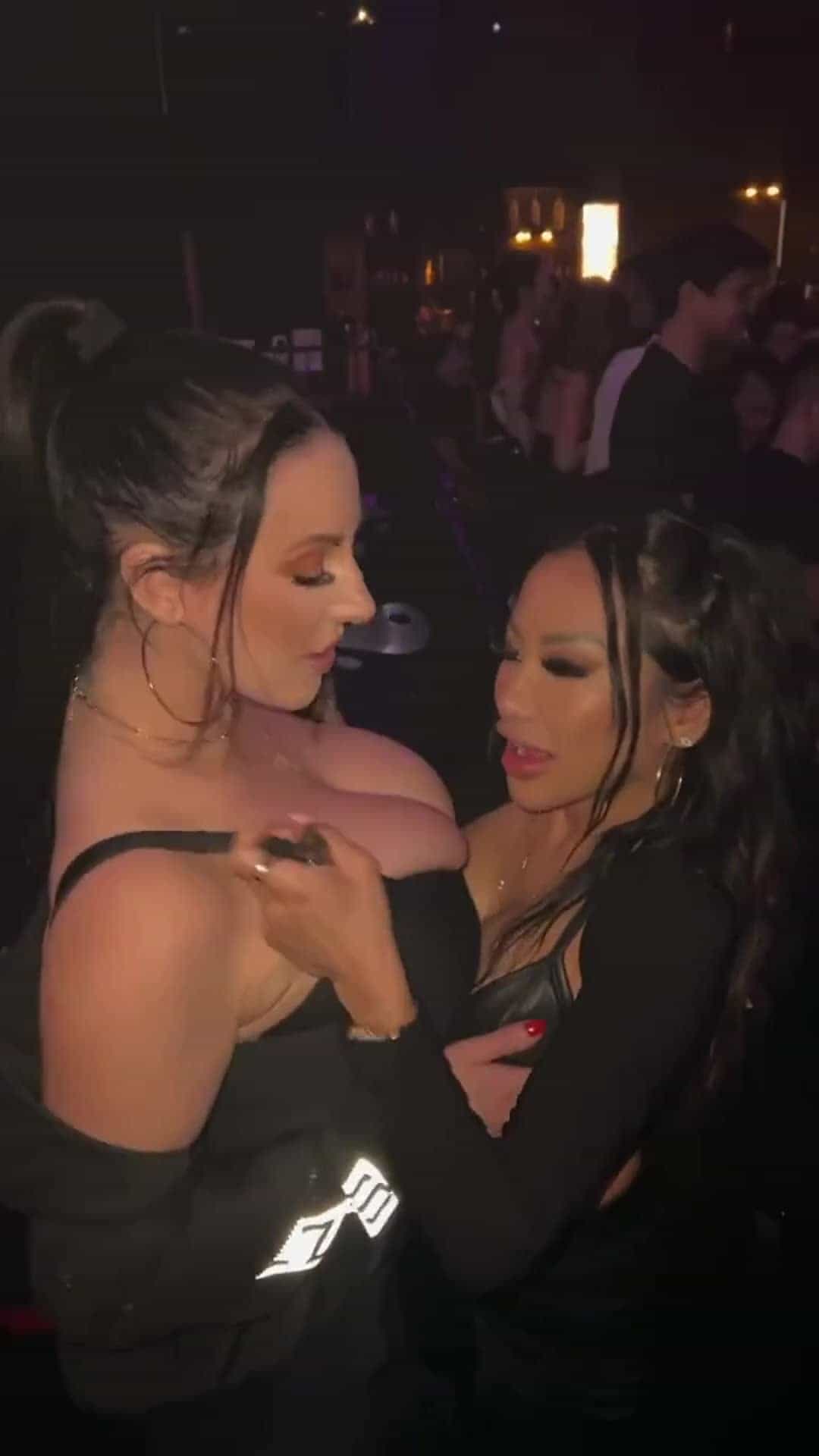 Angela towers over CJ in the club