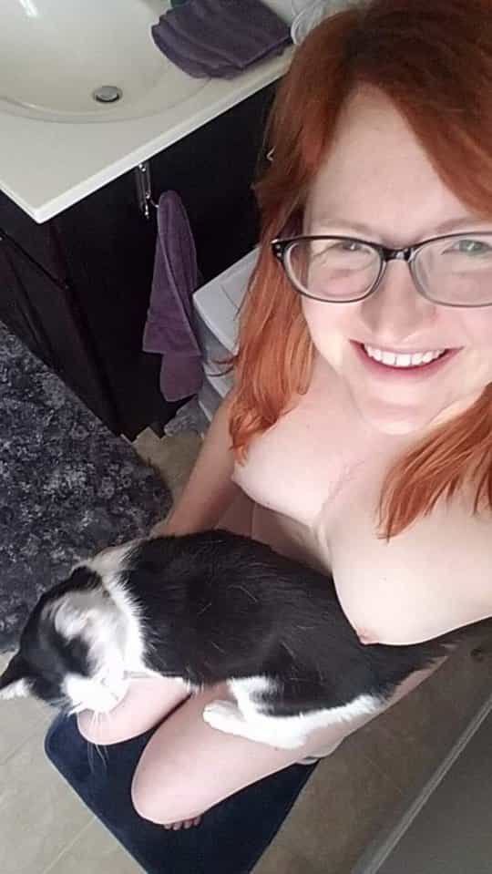 Kitty on my lap with a cute smile and titties out. Hello everyone!