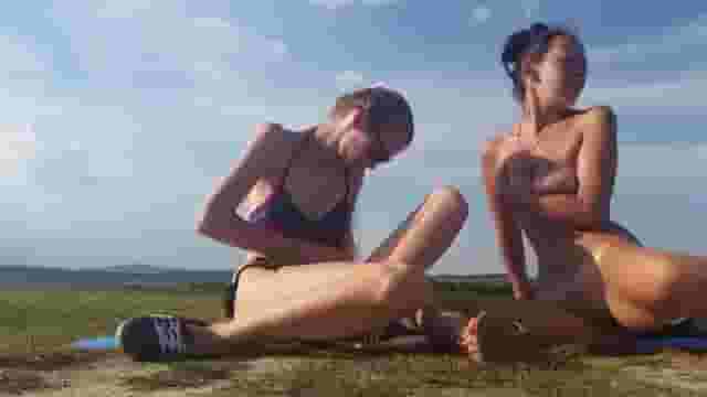 two girls masturbating in a field [gif]