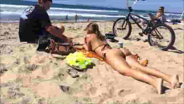 Girl with tight bikini on the beach